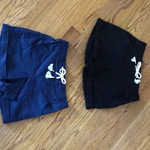 Two pairs of black and navy shorts